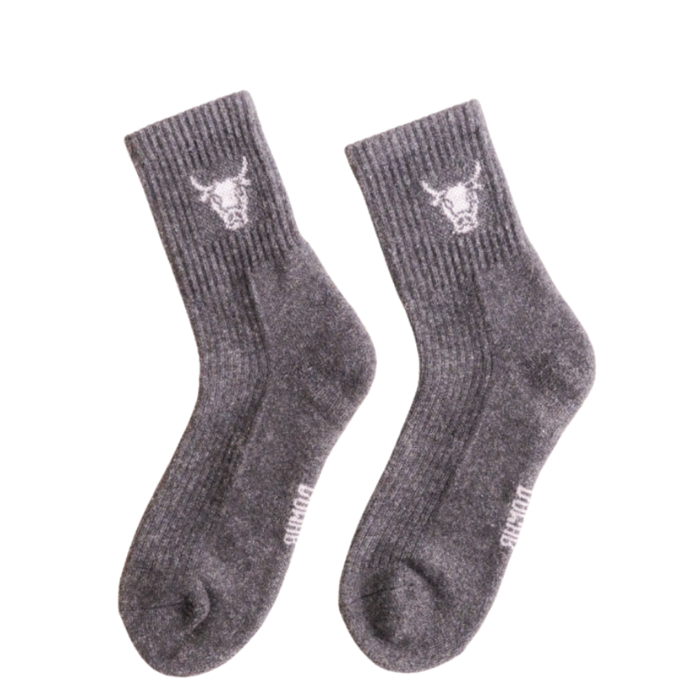 Pair of gray socks with a bull logo on a white background