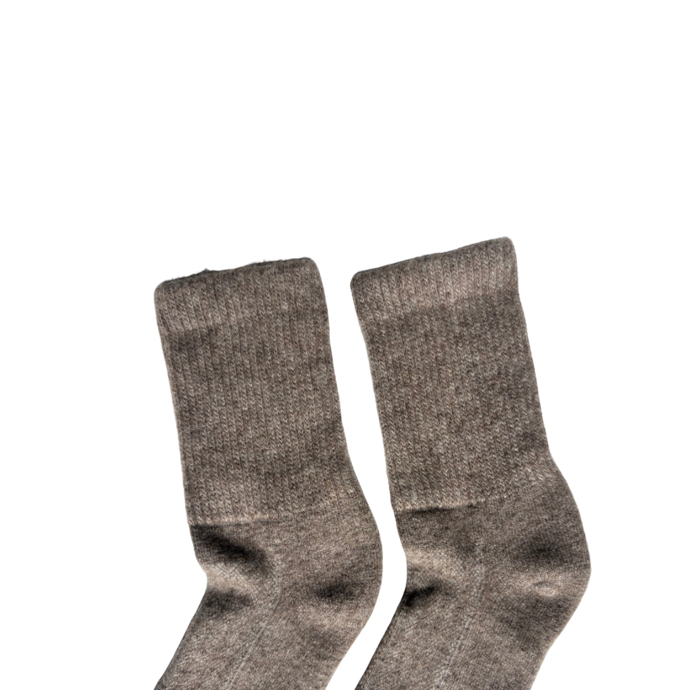 Pair of gray Yak  socks on a white background