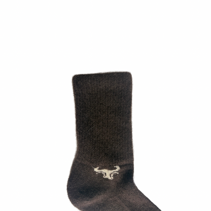 Dark gray Yak sock with a logo on a white background
