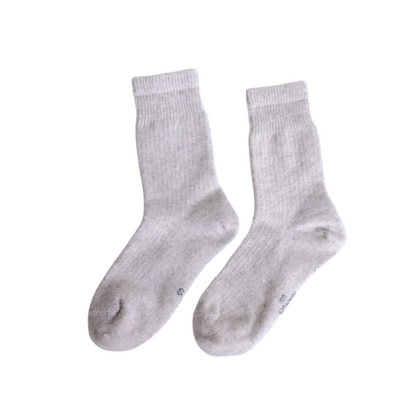 Pair of gray socks on a white background